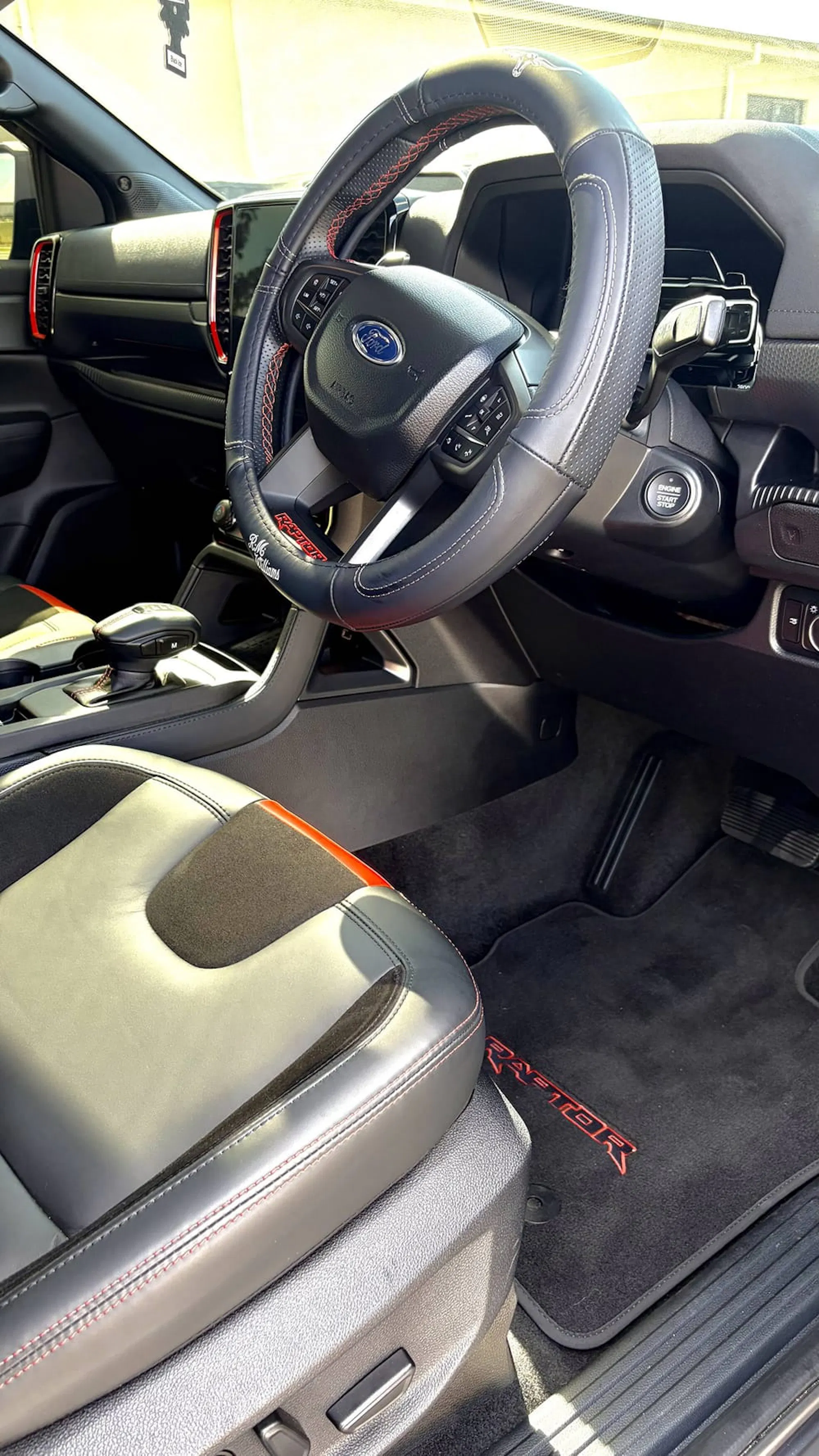 Detailed Ford Ranger interior: steering wheel, console and floor mats cleaned to a fresh finish
